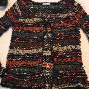 Cute knitted sweater.   Tie on top.